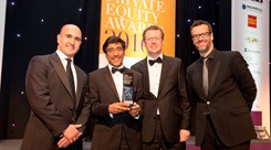 The team collecting their award. The team collecting their award.